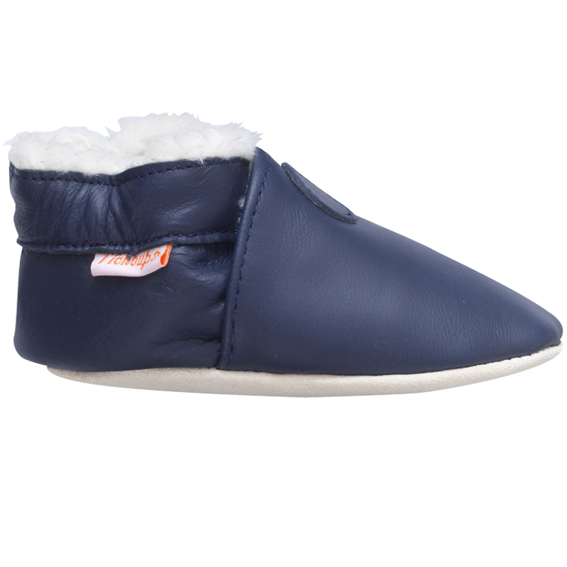 Chaussons pour bébé en cuir souple fourrés coloris marine vue de profil